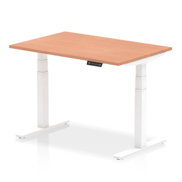 Height adjustable office desk with white frame and USB power ports
