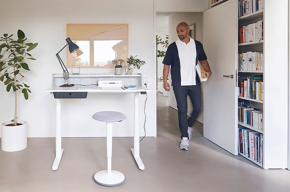 man walking into his home office